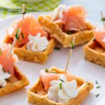 Mini waffles with smoked salmon and lime whipped cream