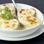 Boiled eggs with bechamel sauce