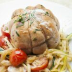 Veal rolls with onions and tomatoes