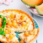 Ricotta-goat cheese tart, melon balls and pine nuts