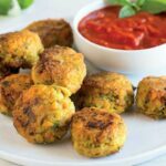 Spicy quinoa balls with vegetables, tomato sauce with herbs