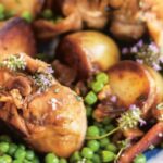Roasted rabbit with peas and new potatoes