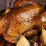 Farm guinea fowl stuffed with gingerbread and winter fruits