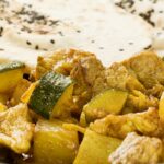 Pork curry with zucchini and grapes
