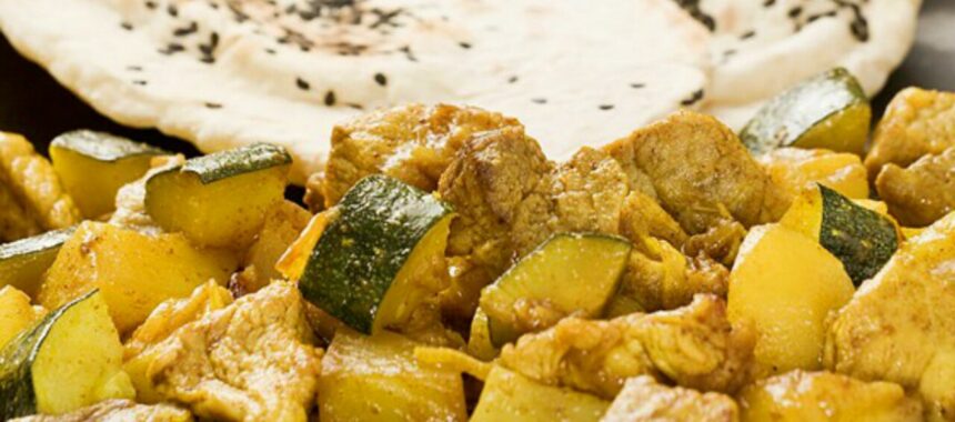 Pork curry with zucchini and grapes