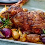 Lamb shoulder confit with garlic, small potatoes in a jacket and red onion