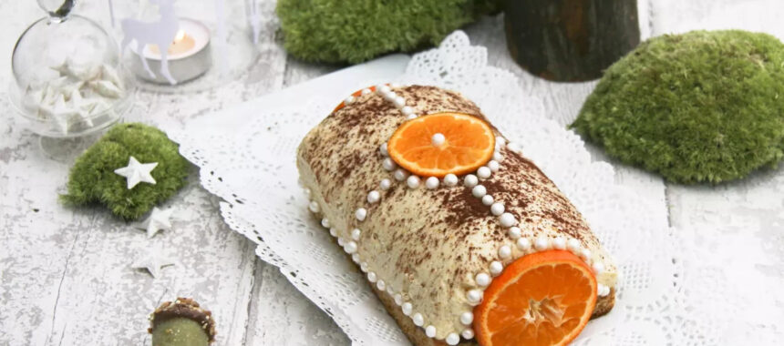 Plant-based Yule log with cashew nuts, clementine and chocolate
