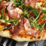 Pizza scarmorza speck and arugula