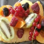 Warm fruit salad cooked in foil with honey