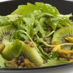 Lentil, kiwi, arugula and green pistachio salad