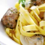 Tagliatelle with veal meatballs and cockles