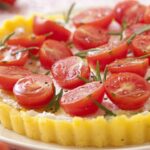 Polenta tart with fresh goat cheese and cherry tomatoes