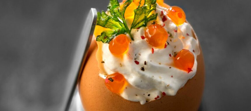 Scrambled eggs with herbs, whipped cream with salmon eggs