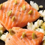 One-sided salmon steak, green olives, crunchy cauliflower with candied lemon