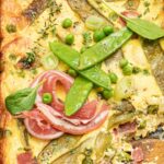 Snap pea clafoutis peas spinach spring onions fresh goat cheese and pancetta