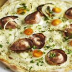 Pizza with fresh cream andouille de Guémené quail egg and Roscoff onion