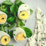 Boiled eggs, yogurt sauce and old-fashioned mustard
