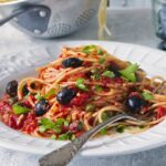 Spaghetti with puttanesca, tomatoes and olives