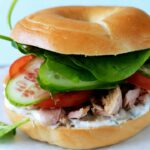Bagel with tuna and raw vegetables