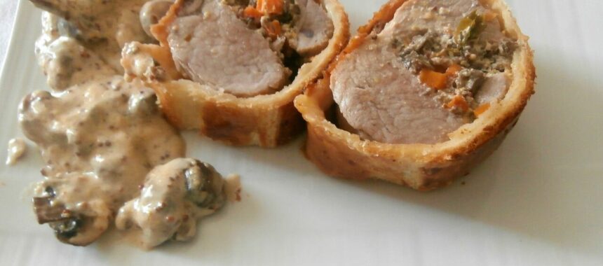 Filet mignon of pork with mustard stuffed with mushrooms in a crust