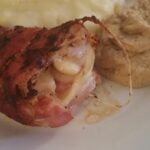 Rolled chicken cutlet with country ham and Emmental cheese with mashed potatoes