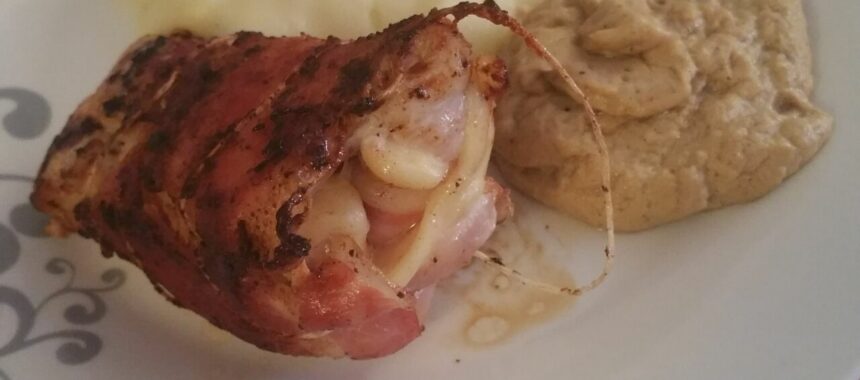 Rolled chicken cutlet with country ham and Emmental cheese with mashed potatoes